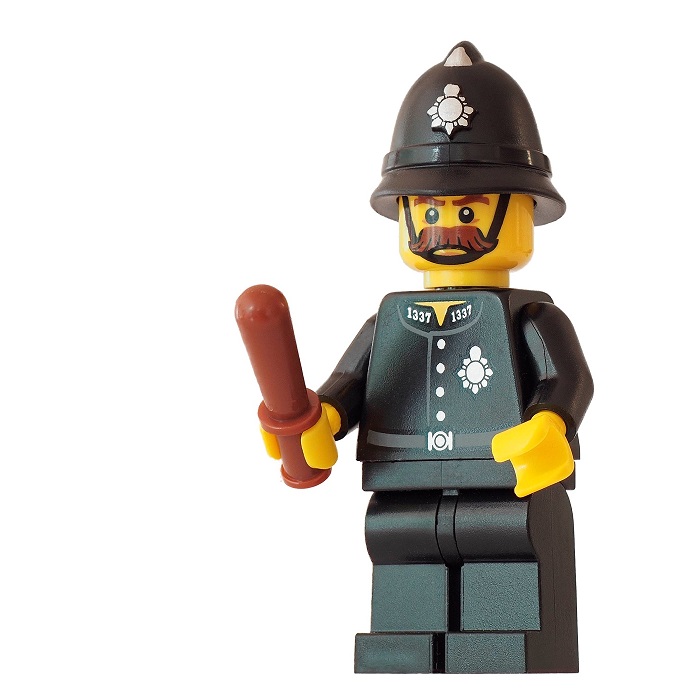 close up of British policeman lego figure with truncheon