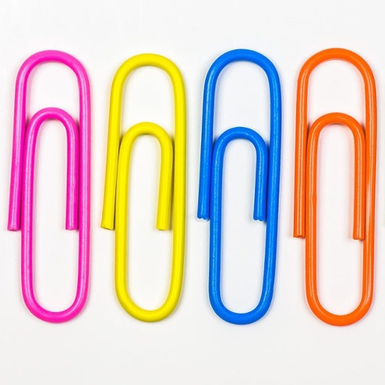 four brightly coloured paperclips